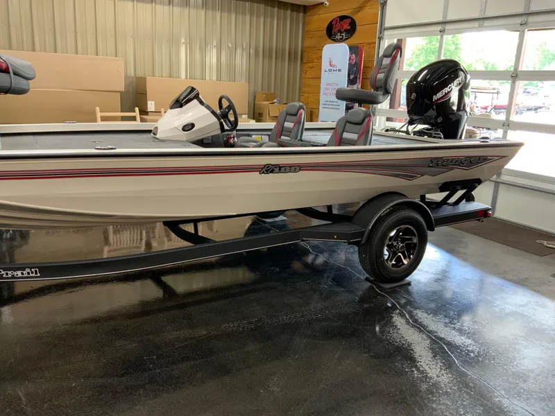 Slide: The Image of 2025 Ranger RT188 boat in showroom, featuring sleek design and Mercury engine. - 3