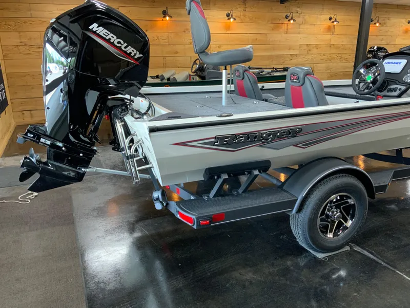 Slide: The Image of 2025 Ranger RT188 boat with Mercury engine in a wooden garage setting. - 5