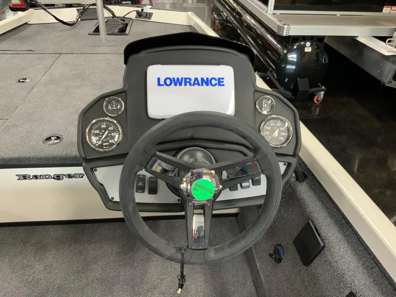 Slide: The Image of 2025 Ranger RT188 boat dashboard with Lowrance display and steering wheel. - 7