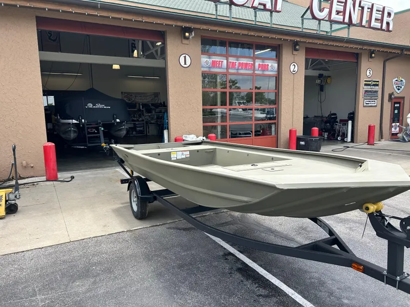 The Image of 2025 Tracker Grizzly 1754 Jon boat on trailer outside service center. - 0