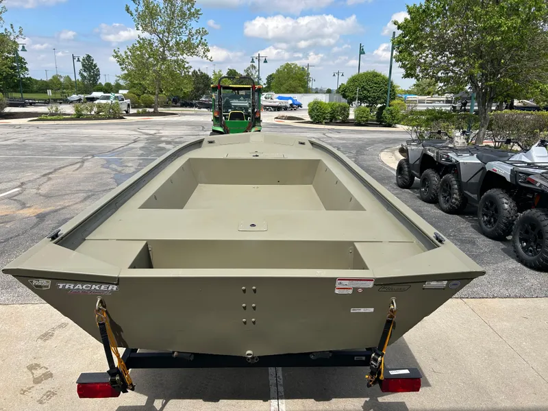 Slide: The Image of 2025 Tracker Grizzly 1754 Jon boat on trailer in outdoor setting. - 2