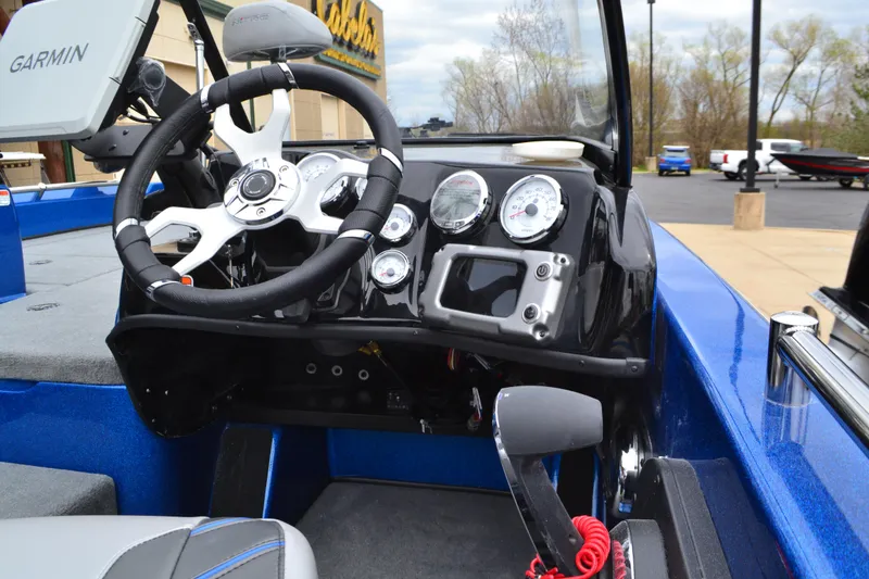 Slide: The Image of 2025 Nitro ZV19 Pro boat dashboard with steering wheel and gauges. - 4