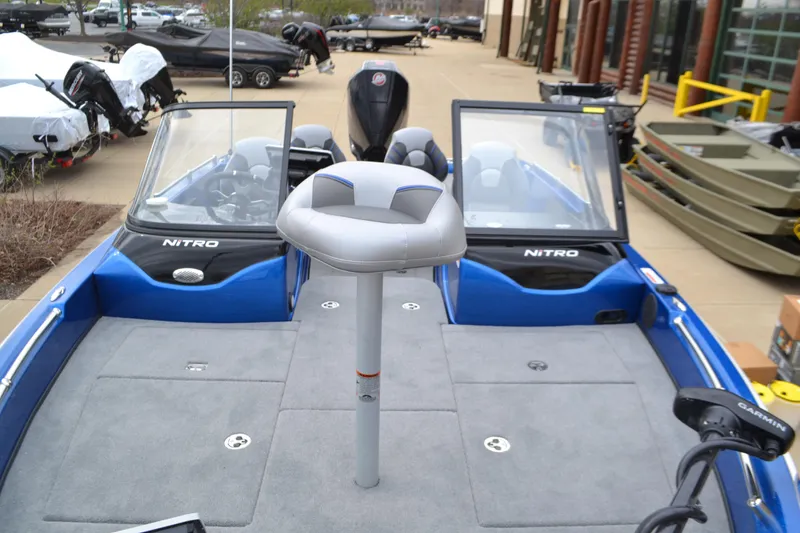 Slide: The Image of 2025 Nitro ZV19 Pro boat with dual consoles and spacious deck, parked outdoors. - 5