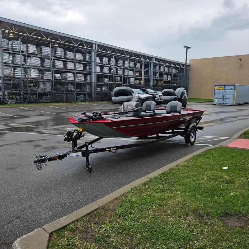Slide: The Image of 2025 Tracker Bass Tracker Classic XL boat on trailer in parking lot. - 2