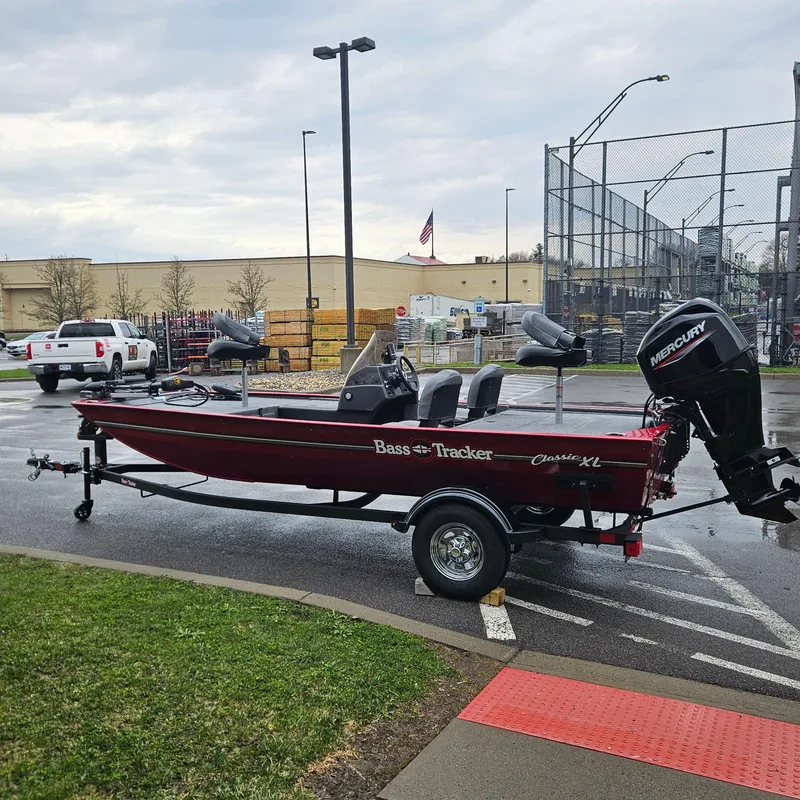 Slide: The Image of 2025 Tracker Bass Tracker Classic XL boat on trailer in parking lot. - 3