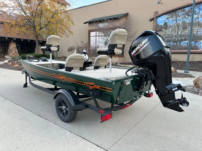 Slide: The Image of 2025 Tracker Bass Tracker Classic Limited boat with Mercury engine on a trailer. - 2