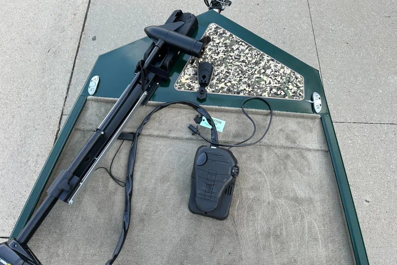 Slide: The Image of 2025 Tracker Bass Tracker Classic Limited boat deck with trolling motor and foot pedal. - 3