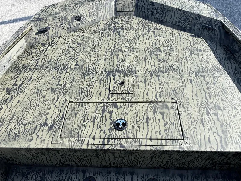 Slide: The Image of 2025 Tracker Grizzly 1860 CC boat deck with camouflage pattern. - 11