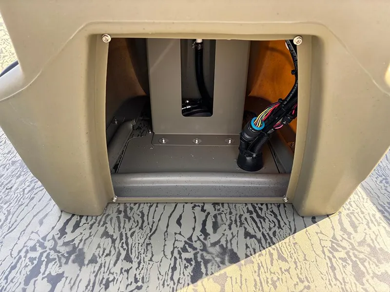 Slide: The Image of 2025 Tracker Grizzly 1860 CC boat interior wiring and compartment detail. - 16