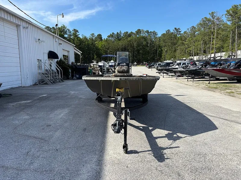 Slide: The Image of 2025 Tracker Grizzly 1860 CC boat on trailer in outdoor dealership lot. - 3