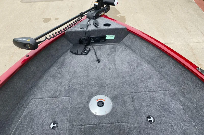 Slide: The Image of 2025 Tracker Pro Guide V-175 WT boat deck with trolling motor and carpeted surface. - 3