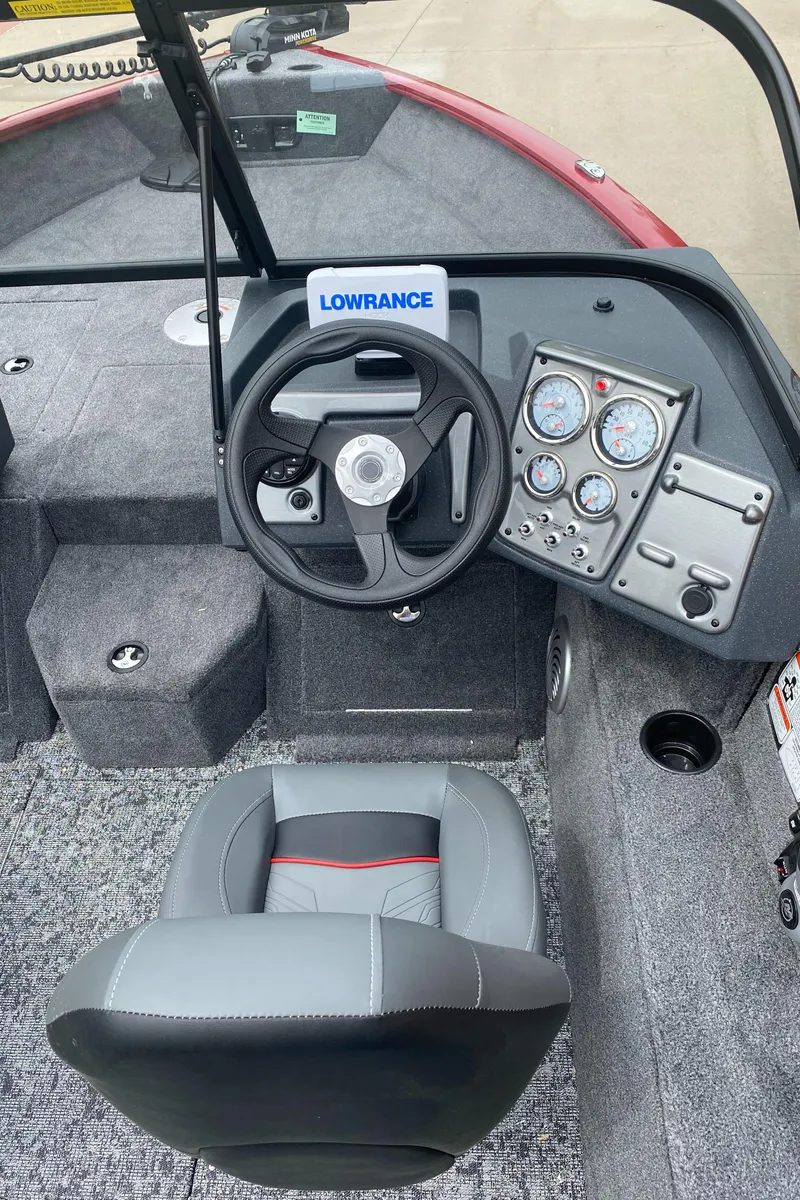 Slide: The Image of 2025 Tracker Pro Guide V-175 WT boat interior with steering wheel and instrument panel. - 5