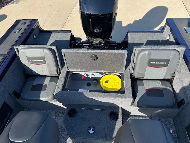 Slide: The Image of 2025 Tracker Targa V-18 Combo boat interior with seating and storage compartments. - 10