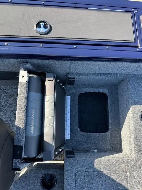 Slide: The Image of 2025 Tracker Targa V-18 Combo boat interior with storage compartments and seating. - 11