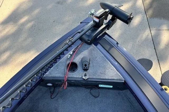 Slide: The Image of 2025 Tracker Targa V-18 Combo boat bow with trolling motor and carpeted deck. - 3