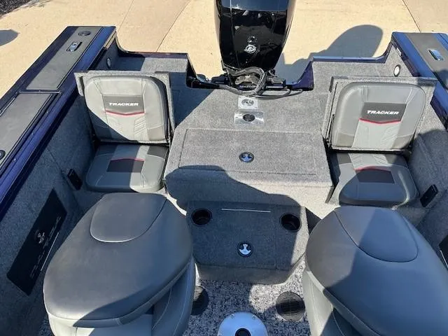 Slide: The Image of 2025 Tracker Targa V-18 Combo boat interior with seating and motor. - 9