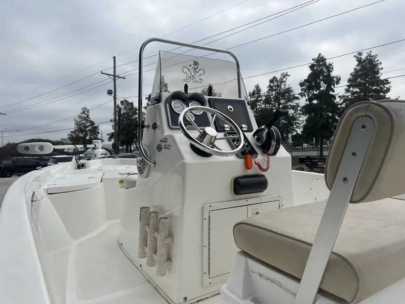 Slide: The Image of 2018 NauticStar 1810 Bay boat interior with steering console and seating. - 3