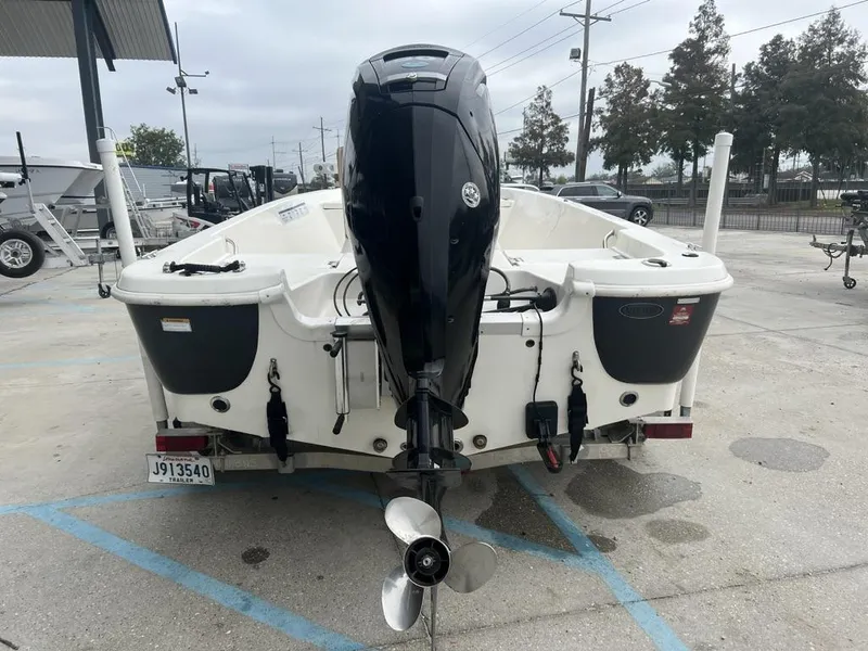 Slide: The Image of 2018 NauticStar 1810 Bay boat with outboard motor, parked in a lot. - 7