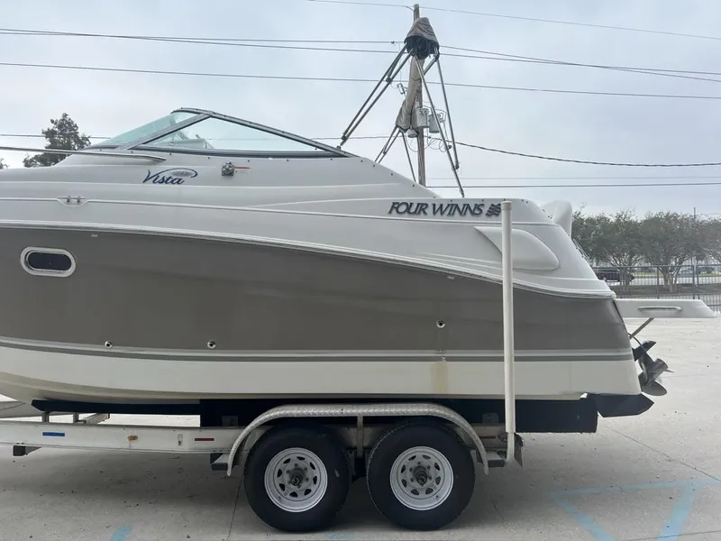 Slide: The Image of 2004 Four Winns 248 Vista boat on trailer, side view. - 6