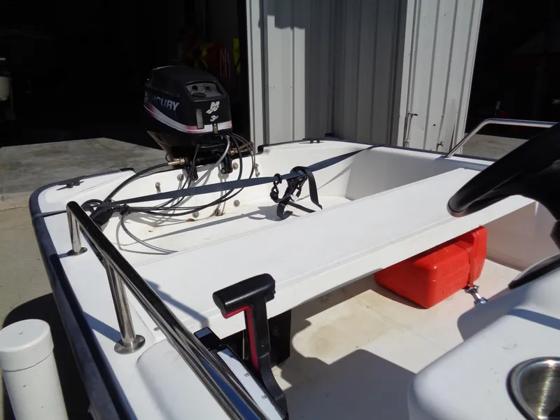 Slide: The Image of 2000 Boston Whaler 13 Sport boat interior with Mercury outboard motor. - 11