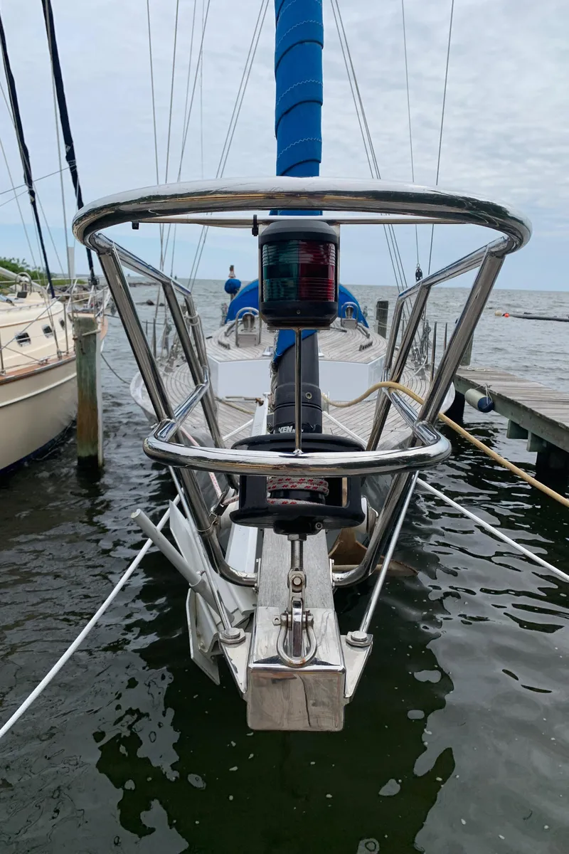 Slide: The Image of Sailboat ShearWater 45, 2004 model, docked with blue sail cover and stainless steel bow. - 11