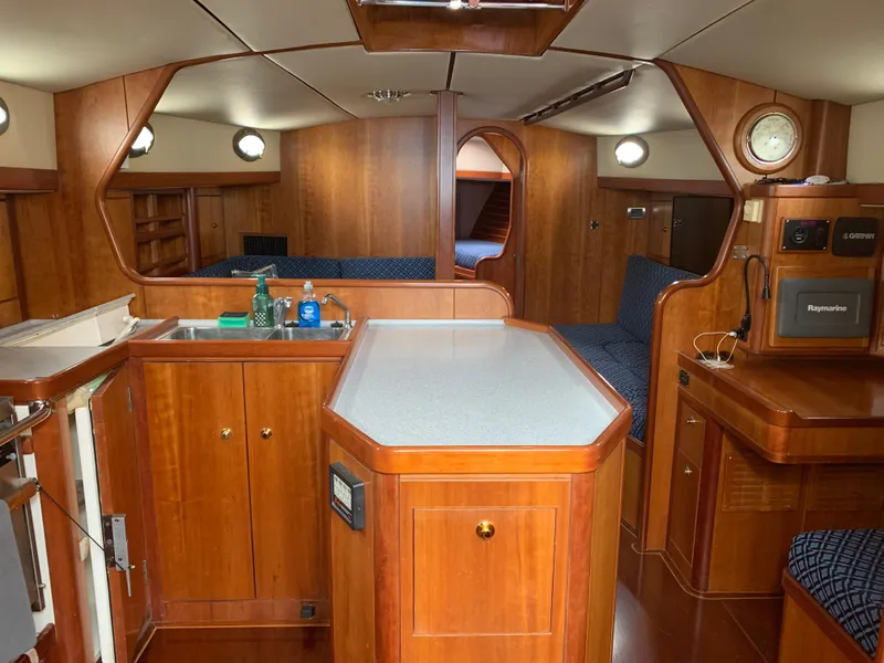Slide: The Image of Interior of a 2004 ShearWater 45 yacht with wooden cabinetry and modern amenities. - 2