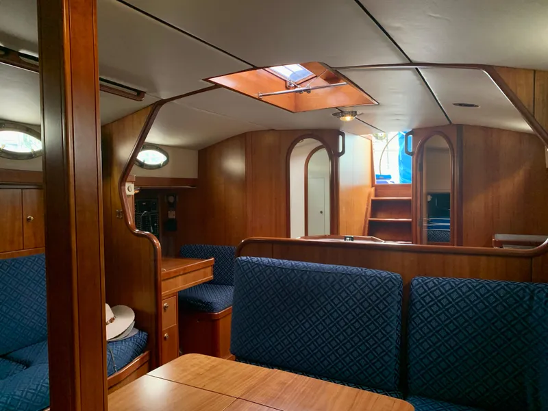 Slide: The Image of Luxurious interior of 2004 ShearWater 45 yacht with wooden finish and blue seating. - 5