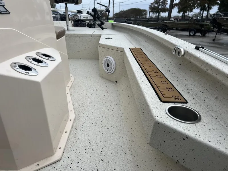 Slide: The Image of 2023 Xpress H20 BAY boat interior with rod holders and measuring ruler. - 11