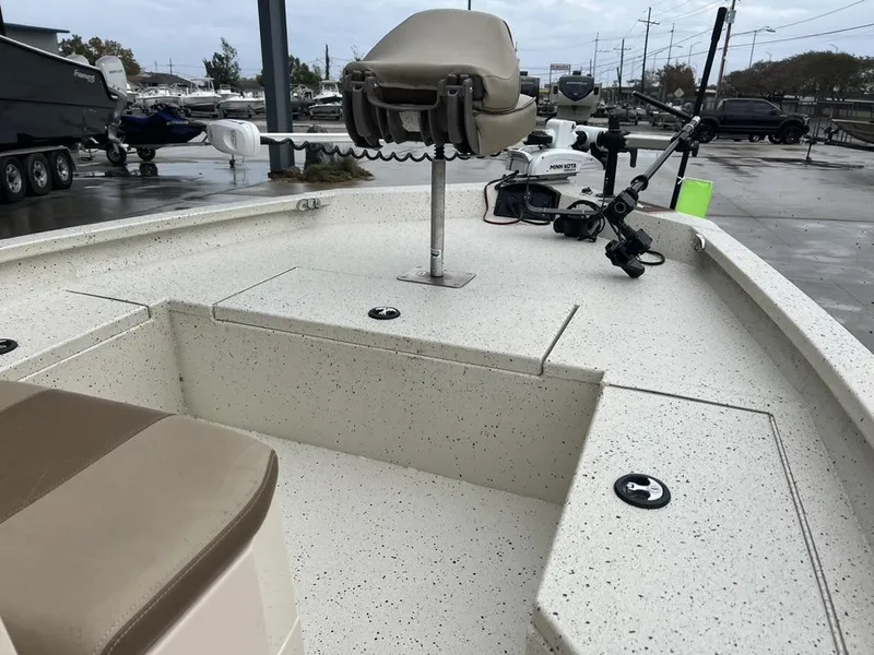 Slide: The Image of 2023 Xpress H20 BAY boat interior with fishing equipment and seating. - 13