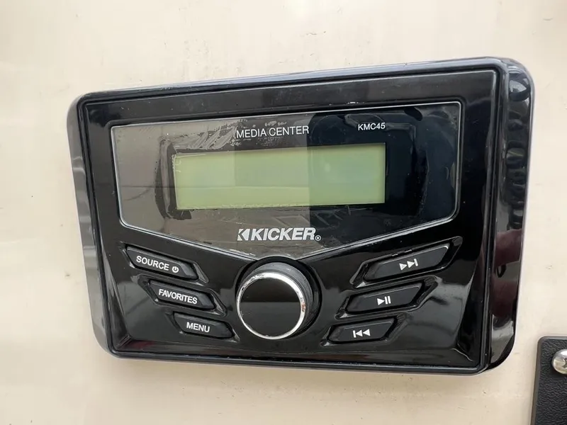 Slide: The Image of Kicker KMC45 media center on 2023 Xpress H20 BAY boat dashboard. - 18