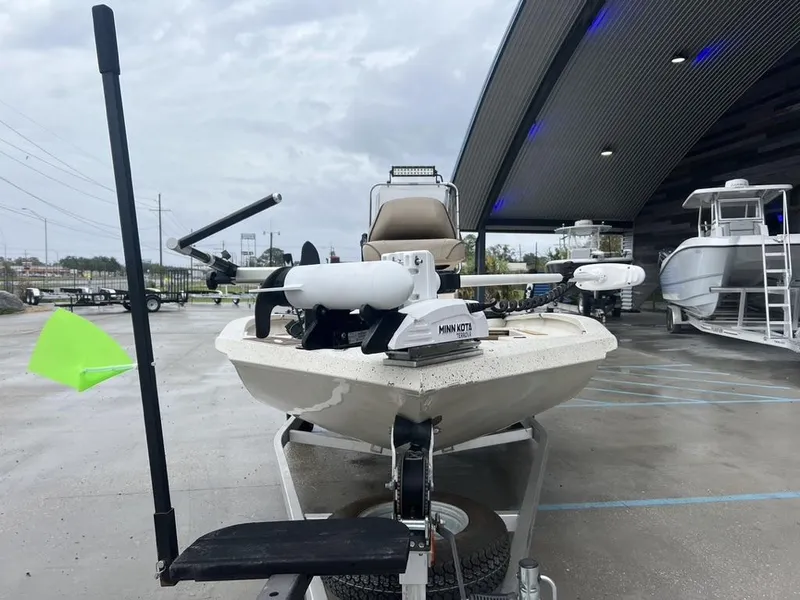 Slide: The Image of 2023 Xpress H20 BAY boat with Minn Kota trolling motor in a showroom. - 3