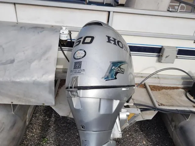 Slide: The Image of Manitou w/ 50HP Honda 1990 - 9