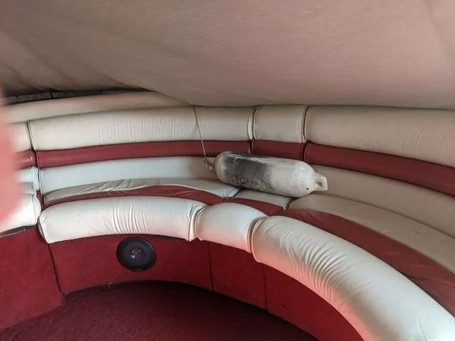 Slide: The Image of 1992 Harris 280 Heritage boat interior with curved seating and a fender. - 3