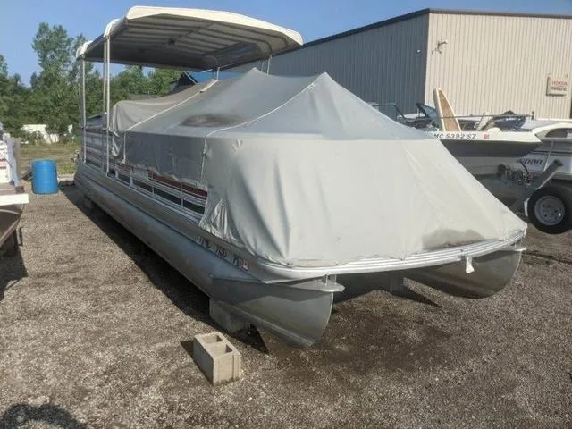 Slide: The Image of Covered 1992 Harris 280 Heritage pontoon boat parked outdoors. - 7