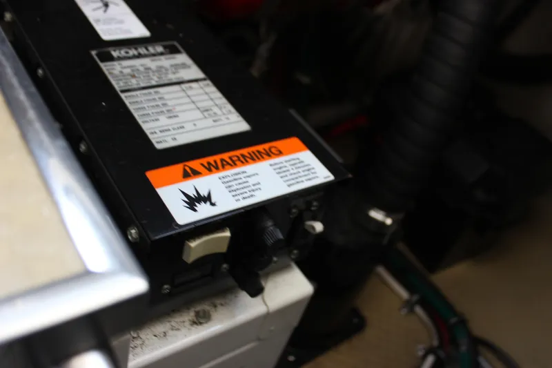 Slide: The Image of Engine compartment of 2005 Larson Cabrio 310 with Kohler generator warning label. - 37