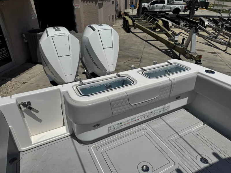 Slide: The Image of 2021 Contender 32ST boat with dual outboard engines and spacious deck layout. - 10