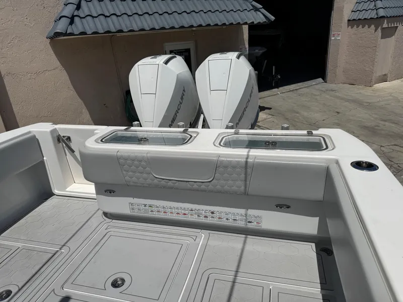 Slide: The Image of 2021 Contender 32ST boat with dual outboard engines and spacious deck layout. - 11