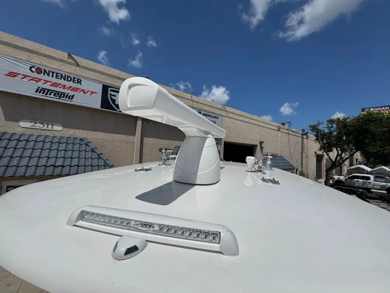 Slide: The Image of 2021 Contender 32ST boat radar and light on deck, dealership background. - 21