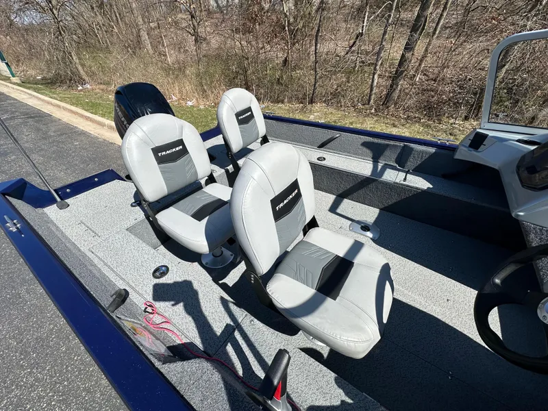 Slide: The Image of 2019 Tracker Pro Guide V-16 WT boat interior with two gray seats. - 5