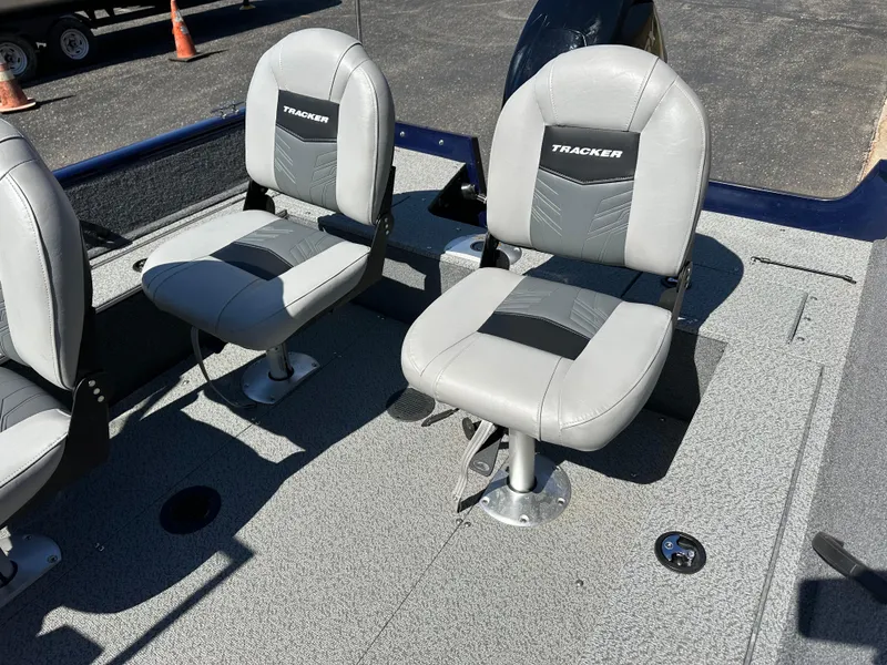 Slide: The Image of 2019 Tracker Pro Guide V-16 WT boat seats, gray and black design. - 7