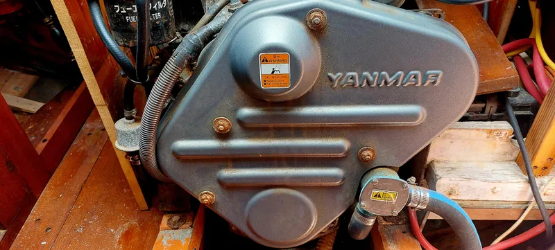 Slide: The Image of Yanmar engine in a 1955 Concordia 41 Yawl sailboat, showcasing mechanical components. - 11