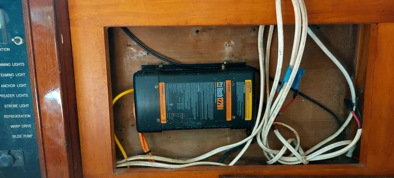 Slide: The Image of Electrical panel with wiring inside a 1955 Concordia 41 Yawl sailboat. - 12