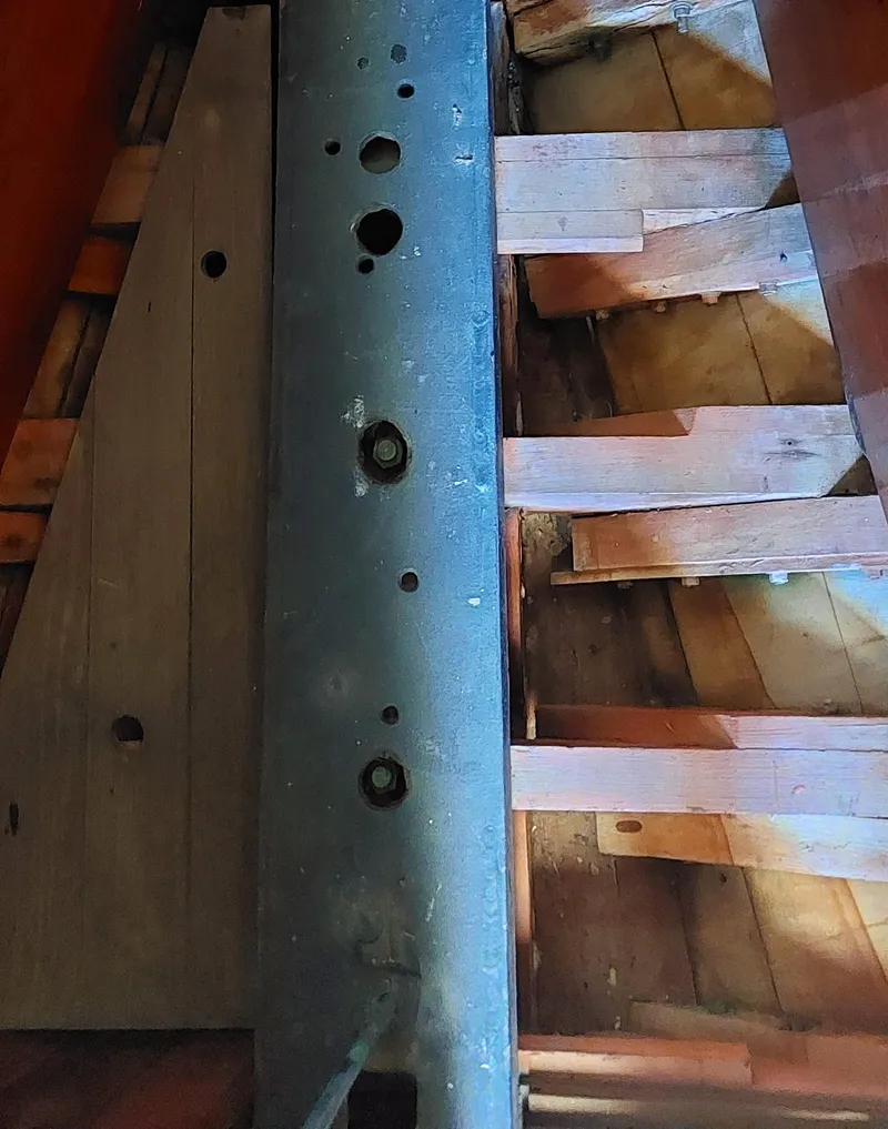 Slide: The Image of Interior view of 1955 Concordia 41 Yawl, showcasing wooden beams and structural details. - 7