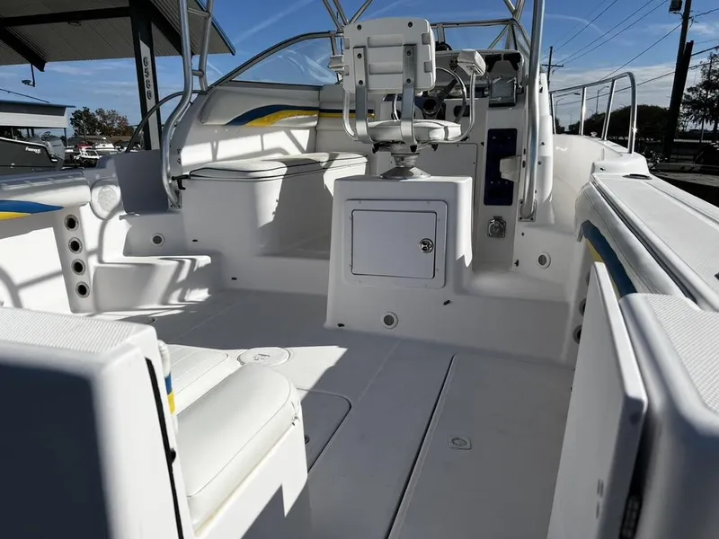 Slide: The Image of 2001 Pro-Line 27 Express boat interior with seating and helm, showcasing sleek design. - 16