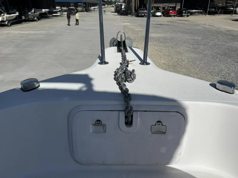 Slide: The Image of 2001 Pro-Line 27 Express boat bow with anchor chain on deck. - 19