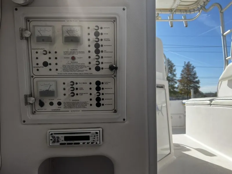 Slide: The Image of Control panel on a 2001 Pro-Line 27 Express boat, featuring gauges and switches. - 24