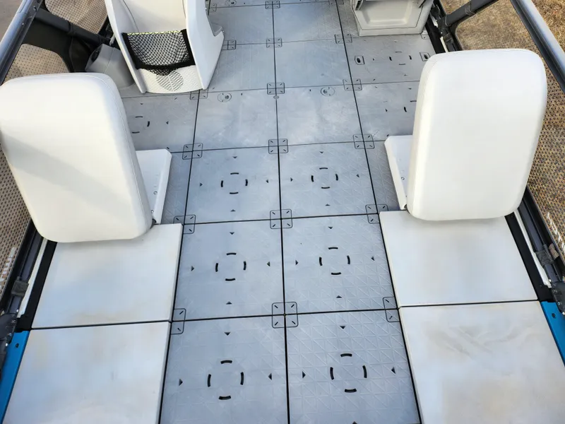 Slide: The Image of 2022 Sea-Doo Switch Sport 21 interior with modular seating and textured flooring. - 9