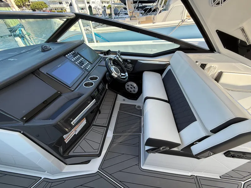 Slide: The Image of 2020 Monterey 385 Super Express cockpit with modern controls and sleek seating. - 36