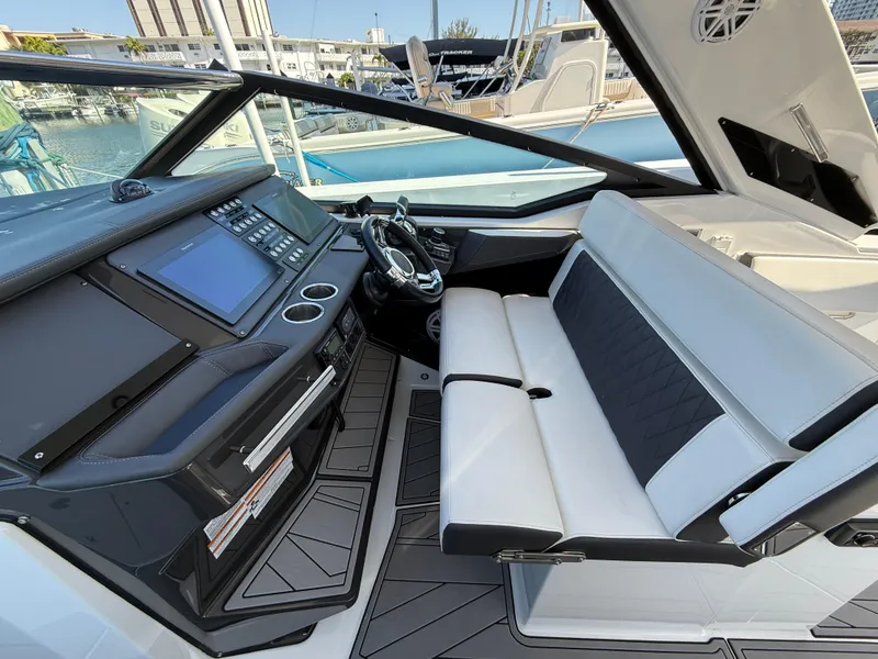 Slide: The Image of 2020 Monterey 385 Super Express cockpit with modern dashboard and seating. - 37