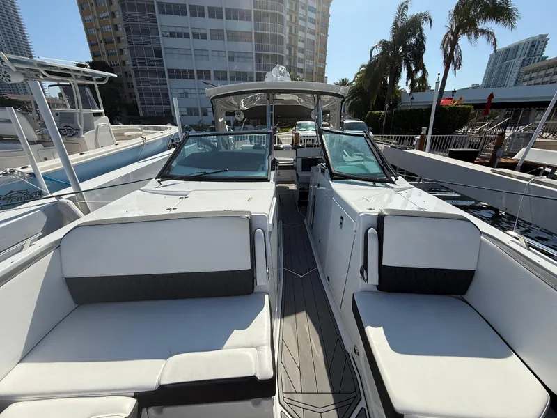 Slide: The Image of 2020 Monterey 385 Super Express yacht with sleek design, docked in a marina. - 51